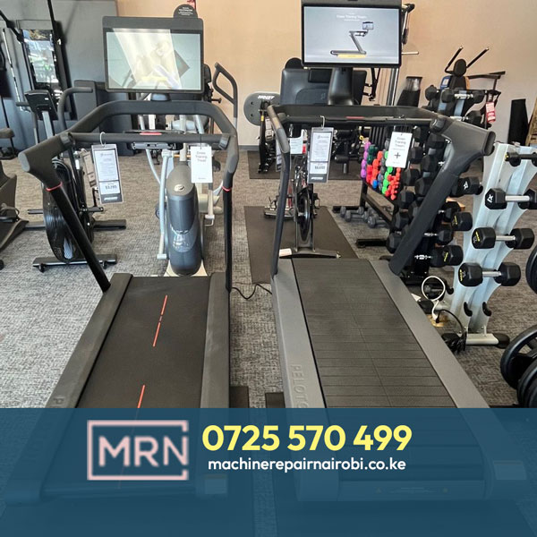 Treadmill repair technician working on a treadmill in Nairobi